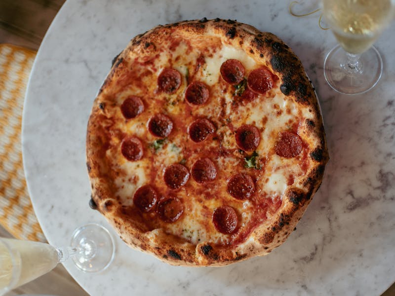 Meat lovers Detroit pizza with sausage and bacon